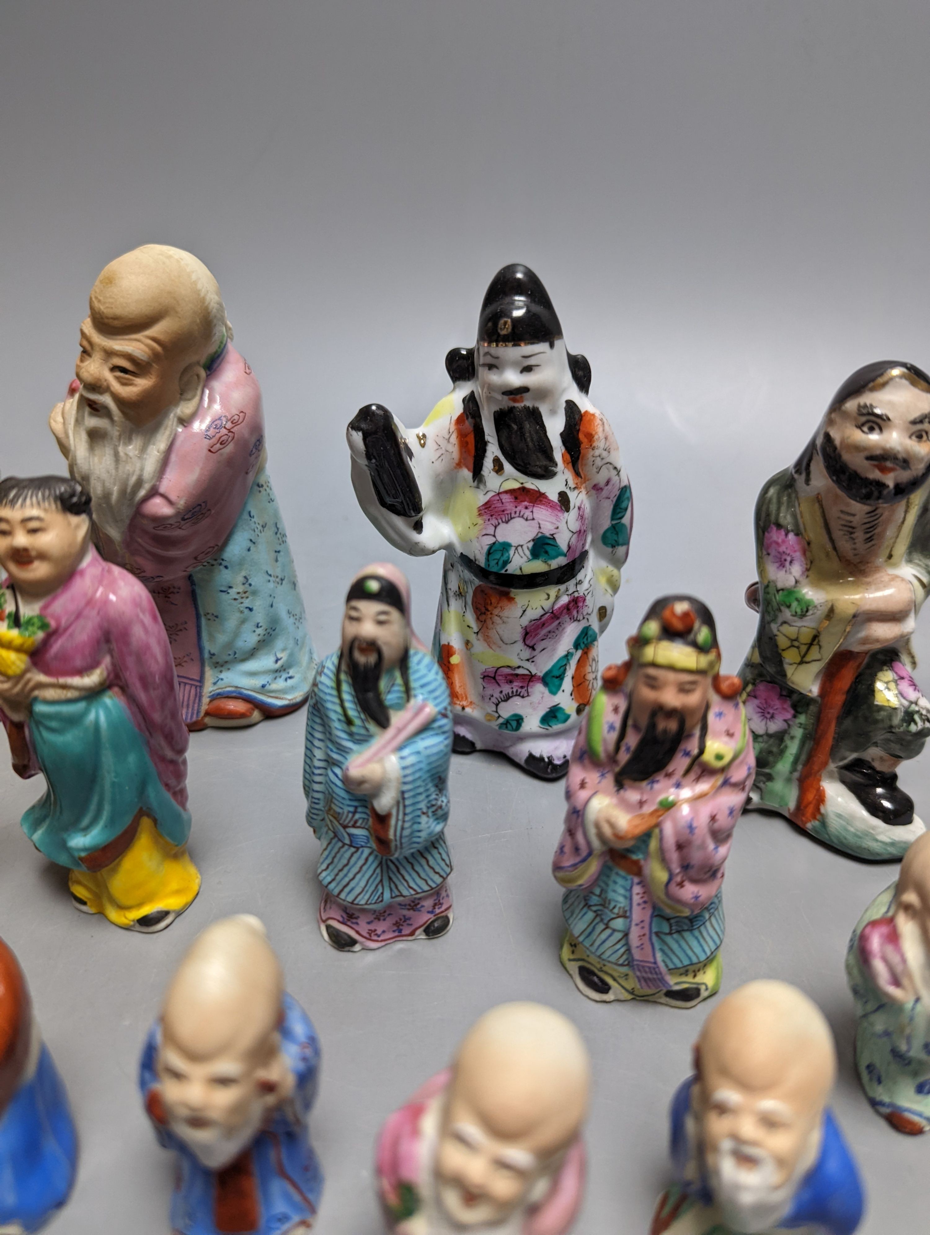 A collection of Chinese enamelled porcelain miniature figurines, including a 19th century Chinese sancai enamelled biscuit figure of a beast, 9cm